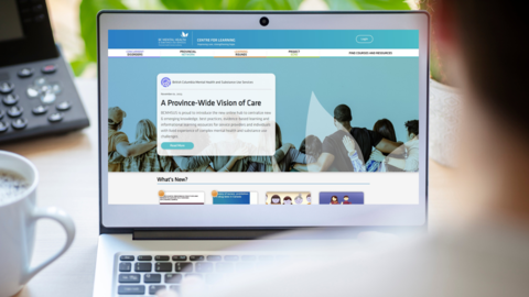 A laptop screen shows the Centre for Learning web page. 