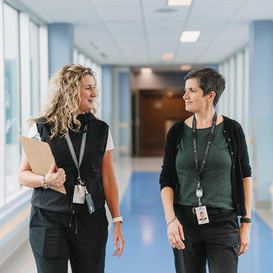 Health professionals walking down a hallway